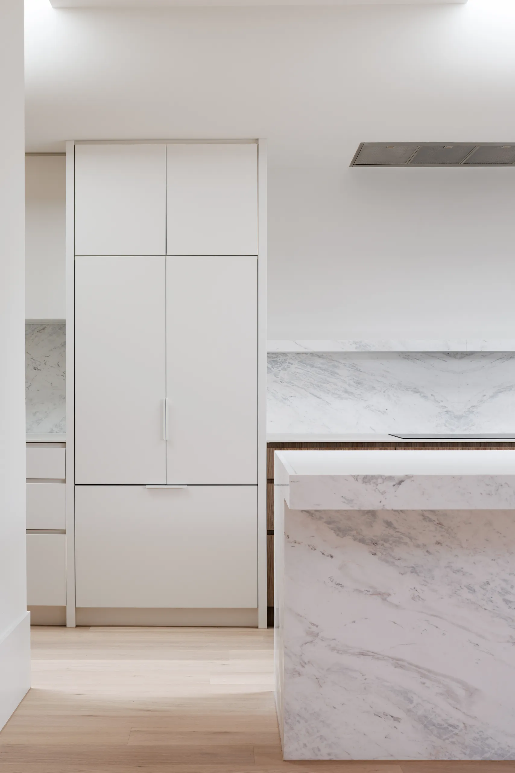 Full-height joinery and marble splashback in the new kitchen