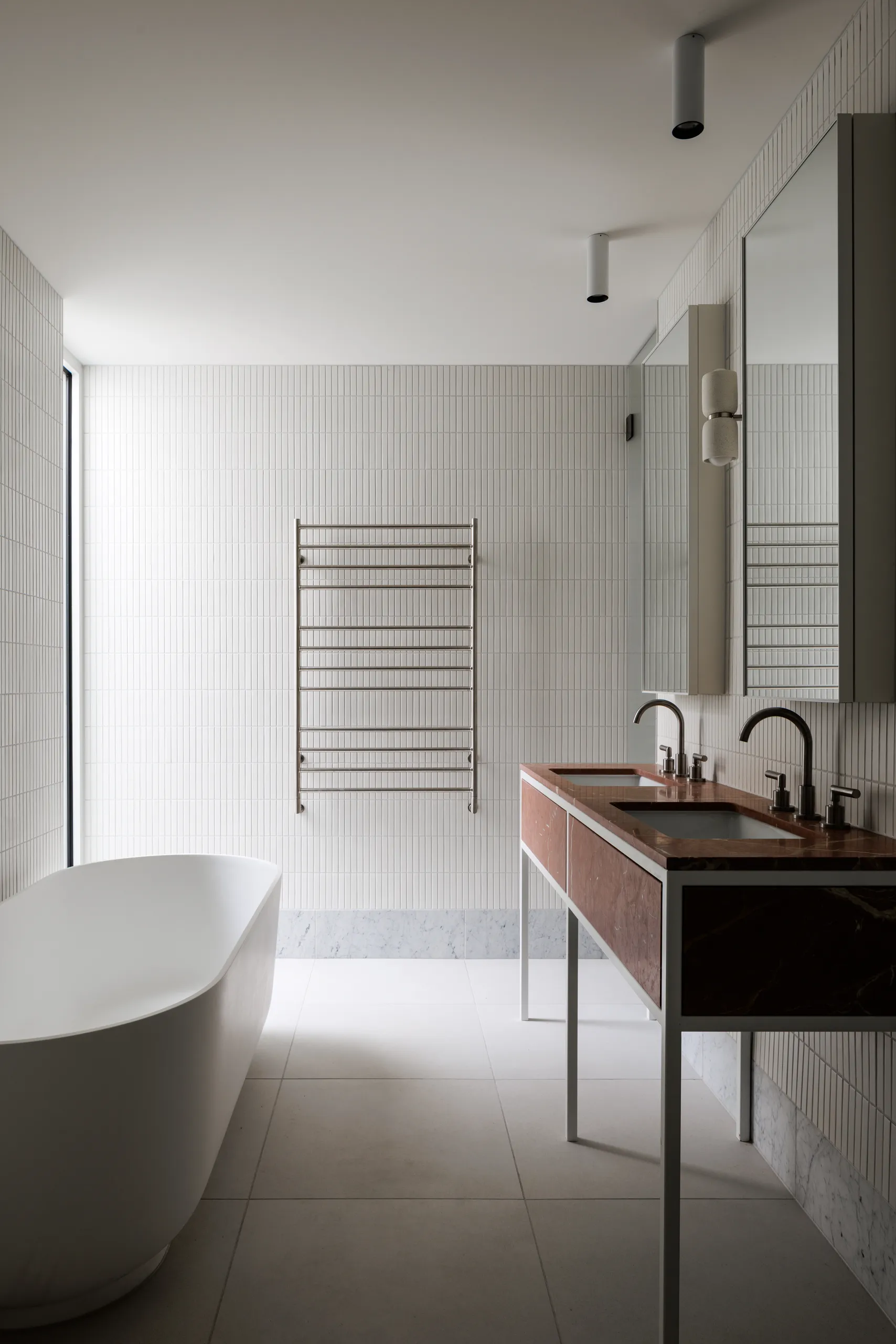 Bathroom with freestanding bath and stone vanity
