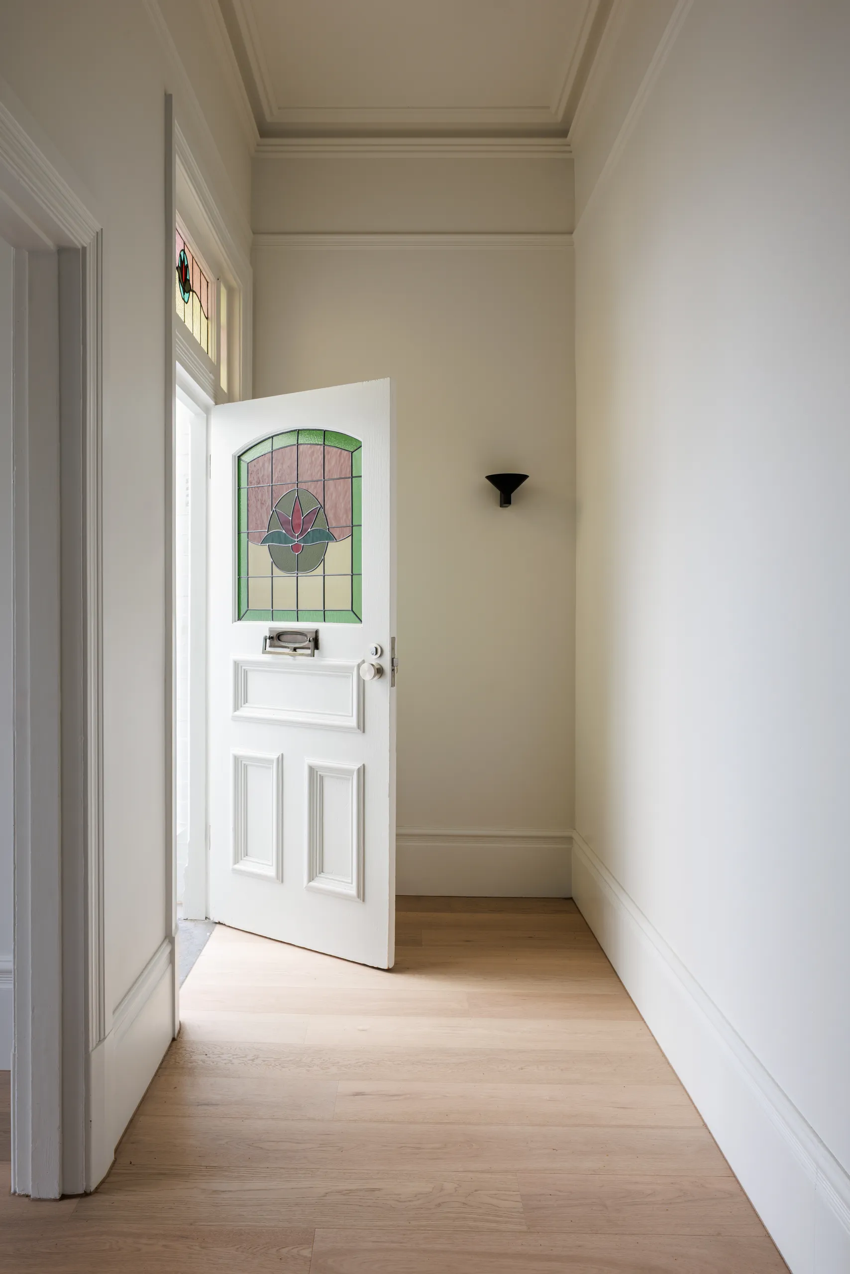 Original leadlight entry door opening into the hallway